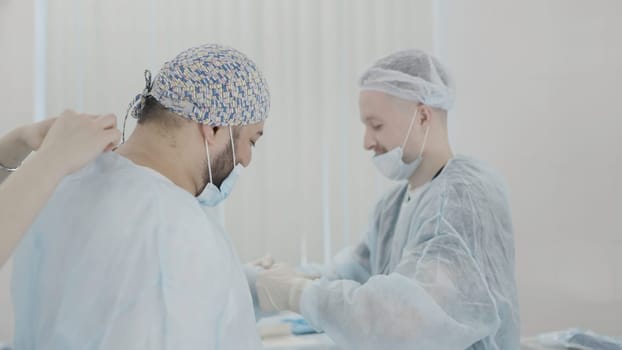 The work of professional doctors. Action. Two men in a suit with equipment are working to help patients. High quality 4k footage