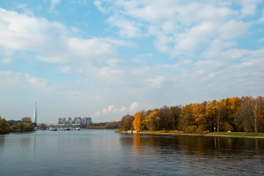 Autumn landscape by the lake and shore. Pond in autumn, yellow leaves, reflection. High quality photo