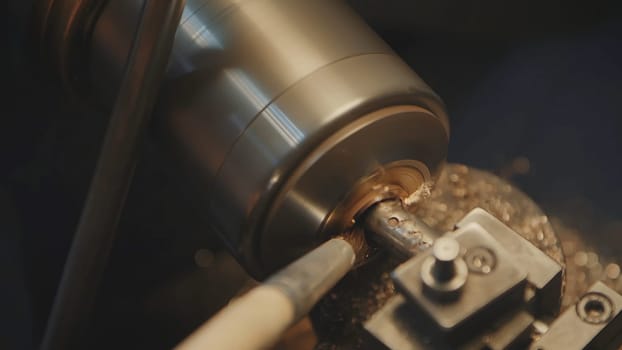 Production of rings. Jeweler working with wax model ring in his workshop. Craft jewelery making. Detail shot with low depth of field. Jeweler making handmade jewelry on vintage workbench. Craft of jewelery making. Repairing ring by inlaid tight gem.