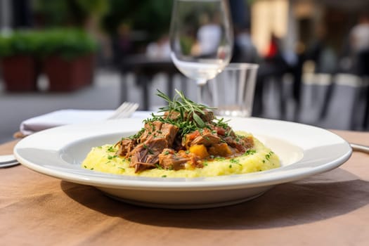 Cassoeula, traditional Lombardy dish with a stew made with pork meat and cabbage, often served with polenta. Italian seasonal comfort dish.