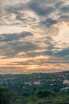 Abstract background sky Dawn Sunset Contrast dark shadow bright cloud sun orange silhouette above the mountains near the sea.