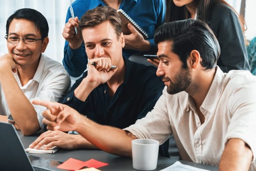 Group of diverse office worker employee working together on strategic business marketing planning in corporate office room. Positive teamwork in business workplace concept. Prudent