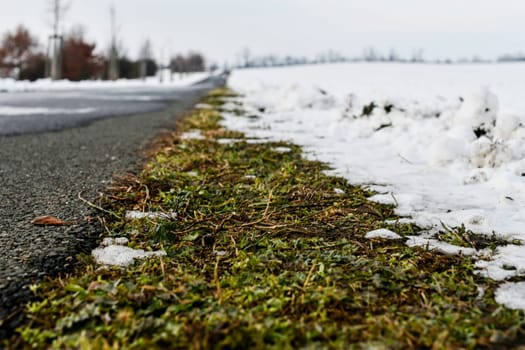 Road ploughed through by snow plough in winter. Roads plowed in winter. Concept of winter and winter road maintenance. 