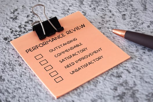 Performance Review checklist on sticky notes. Performance review concept