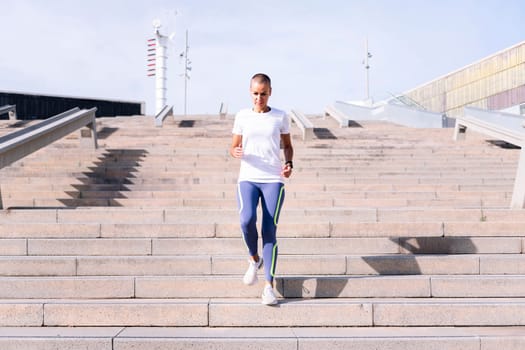 sporty woman training on stairs, concept of active and healthy lifestyle