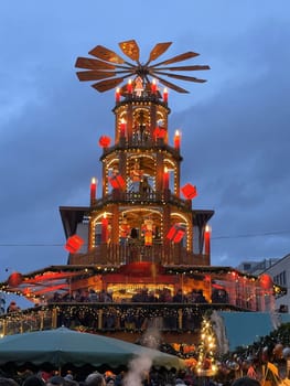 Scenic Christmas market, in the center of the Christmas market, 11 december 2023, in Fulda Hesse, Germany, a building stands and glows with different lights, inviting everyone to visit it.. High quality photo