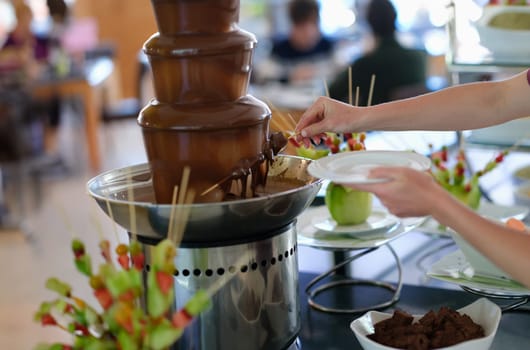 Man fills spoonful of fresh homemade. Delicious drink for breakfast concept