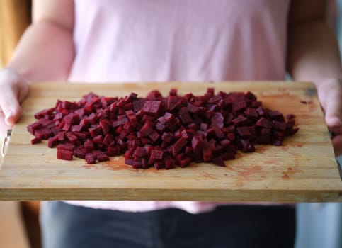 Fresh homemade sliced beets on cutting board. Natural ingredients for preparing vegan food.