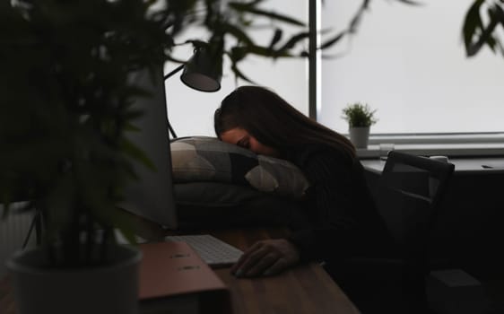 Freelance woman exhausted by hard work is sleeping in office. Overload work at home at night remotely, self-isolation