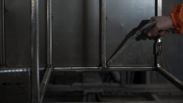 Blowing air on the metal parts before powder painting. Clip. Worker in protective equipment cleans the metal construction before painting them. Aluminum Air Duster Blower Gun Cleaning Clean Handy Tool.
