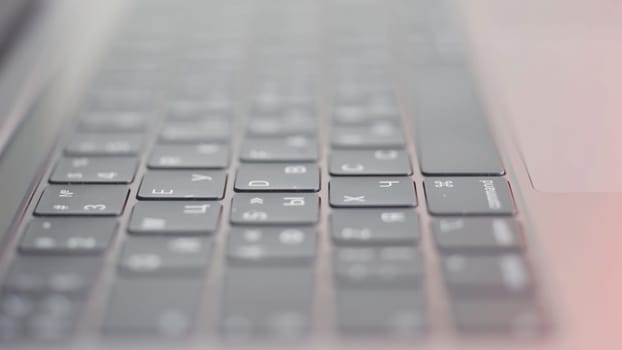 Close up of computer black keyboard. Technological background with the new modern flat keypad of the laptop.