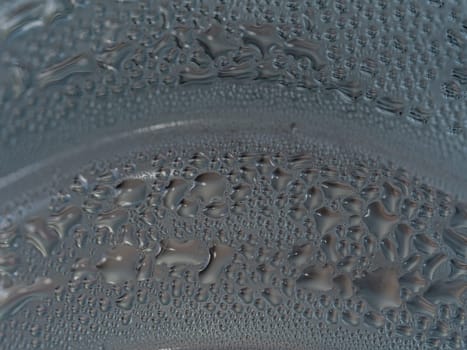 Water droplets are formed by condensation on a cold water bottle