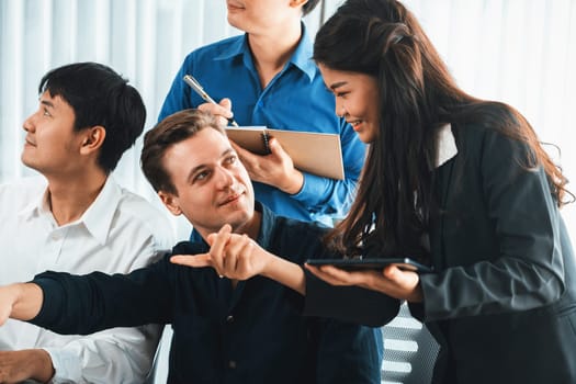 Group of diverse office worker employee working together on strategic business marketing planning in corporate office room. Positive teamwork in business workplace concept. Prudent