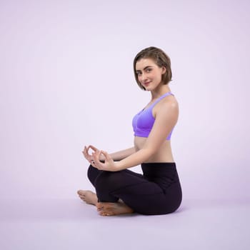 Full body length gaiety shot athletic and sporty woman doing healthy and meditative yoga exercise workout posture on isolated background. Healthy active and body care lifestyle