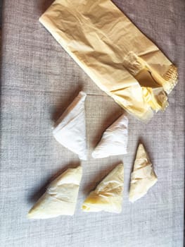 Plastic bag folded into triangle for storage. Ways of storing and laying at home