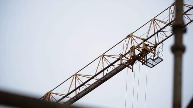 Industrial yellow crane and sky on construction. Clip. Tower yellow crane.