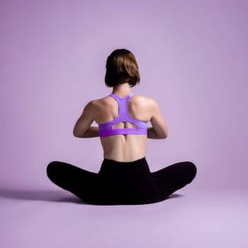 Full body length back rear view gaiety shot athletic and sporty woman doing healthy and meditative yoga exercise workout posture on isolated background. Healthy active and body care lifestyle
