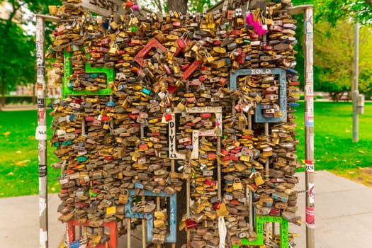 Paris, France - 23 February, 2023: Many wedding locks attached on bridge