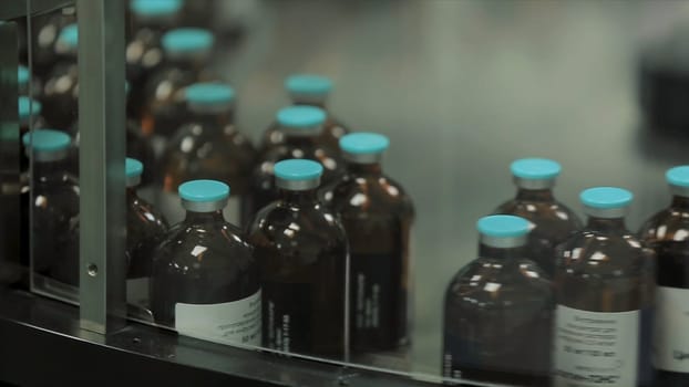 Pharmaceutical industry. Production line machine conveyor at factory with bottles. pharmaceutical production of liquid pharmaceuticals HD