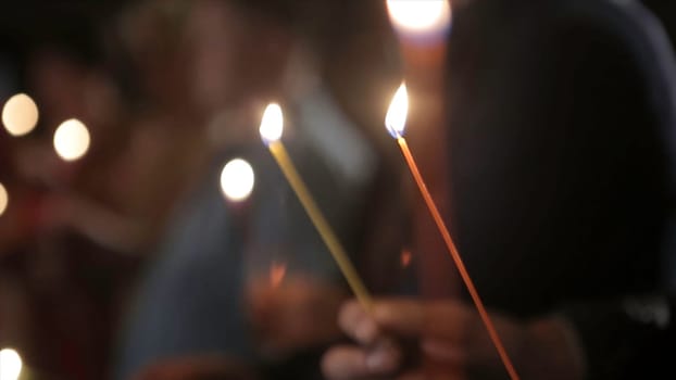 Lighting A Candle With A Match To Get A Romantic Candlelight. Amazing andles and candlesticks are on the table. Stay lights with the peaceful background of religious ceremony HD