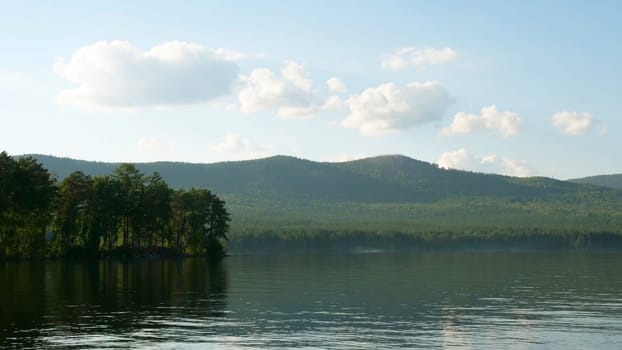 Summer landscape with river, cloudy sky, forest and sun timelapse. summer landscape with river and blue sky time lapse. Amazing clouds on the lake coast.