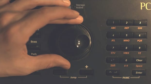 Hand tuning fm radio button. Retro image processed. Hand adjusting volume control. Broadcasting and music concept. woman turning button of radio in car. Woman hand adjusting volume control HD