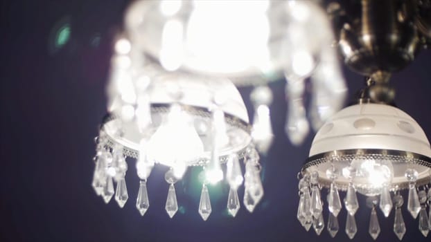 Chrystal chandelier close up, selective focus. Chrystal chandelier close-up. Crystal chandelier close-up. Glamour background with copy space.