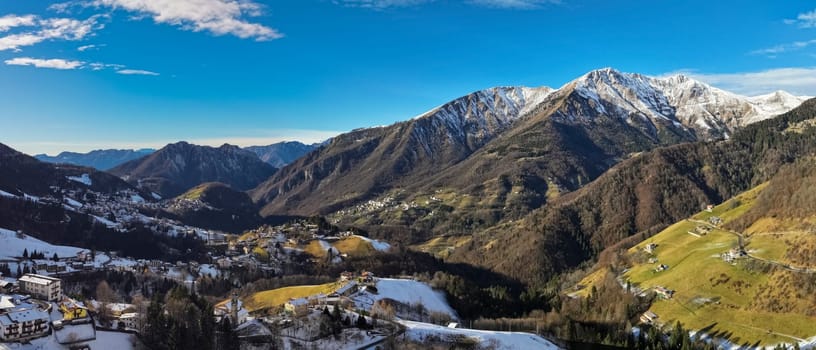 Aerial view of Riso valley and Zambla town,background Orobie alps, Lombardy, Italy