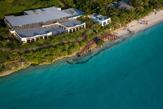 Wonderful aerial shot of shoreline and turquoise ocean in zanzibar at sunny day, tanzania.