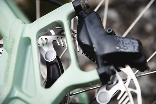 Close-up of a bicycle frame. Macro shot of mounting the frame on a bicycle, where the bolt is screwed in.