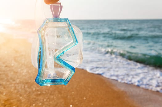 white and blue diving mask against the background of sea waves. snorkeling equipment in the sun, without people.