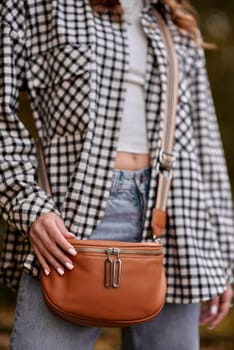 Autumn Elegance: Girl with Warm Tones, Casual Style, and a Park Stroll. ashion trends, autumn style, casual elegance, outdoor fashion, trendy accessories, park lifestyle, cozy vibes, seasonal warmth, stylish look, autumnal hues