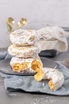 Sweet portuguese donuts with white glaze. Donuts baked at home. Simple and tasty dessert.