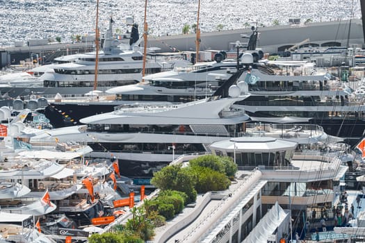 Monaco, Monte Carlo, 27 September 2022 - a lot of luxury yachts at the famous motorboat exhibition in the principality, the most expensive boats for the richest people around the world, yacht brokers. High quality photo