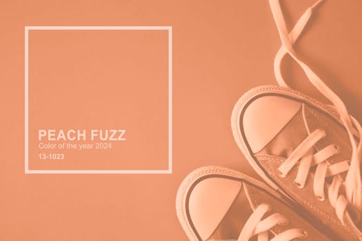 Peach Fuzz monochrome sneakers. Trendy color 2024 concept. High quality photo