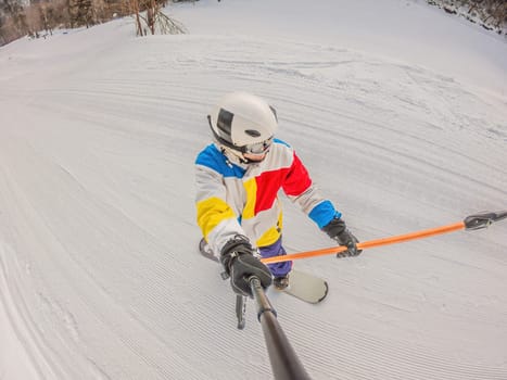 A daring man conquers snowy slopes with style, showcasing skill and thrill as he maneuvers on a snowboard, capturing the essence of winter adventure.