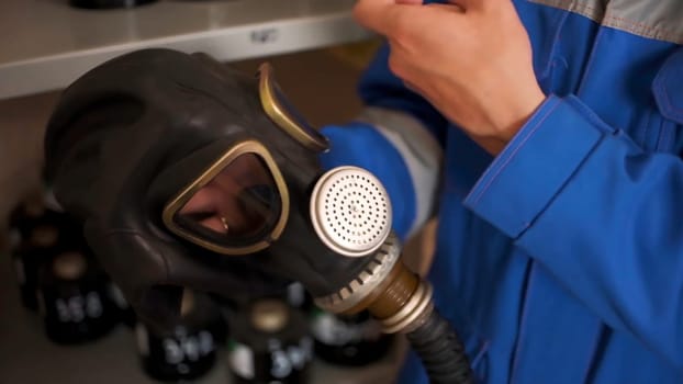 Checking gas masks. Clip. Testing of new gas masks in the workflow at factories.