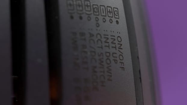 Close up of electronic device with designation of symbols. Action. Concept of technological progress