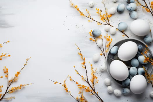 Easter background with eggs and branches in light pastel colors.