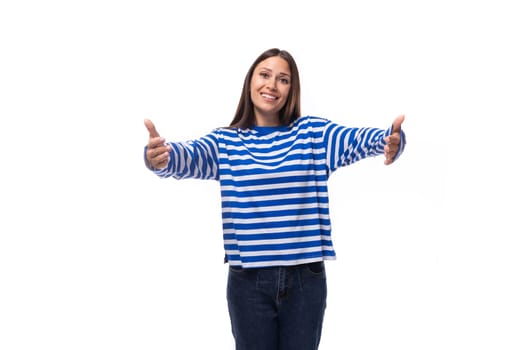 young smiling slender european brunette woman dressed in a casually striped sweater.