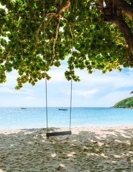 a swing on the beach of Koh Samet Island Rayong Thailand, the white tropical beach of Samed Island with a turqouse colored ocean