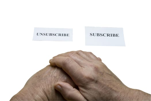 The choice concept. Tickets with the word subscribe and unsubscribe and  the hands of a man with a transparent background