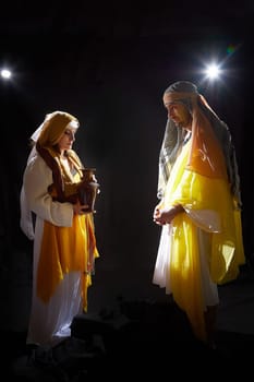 A couple in love or a married couple in stylized Eastern clothing from Israel, Palestine, Iran, Pakistan together. Tender photo session in the style of the Middle East and the Bible