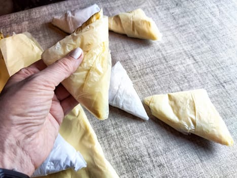 Plastic bag folded into triangle for storage. Ways of storing and laying at home