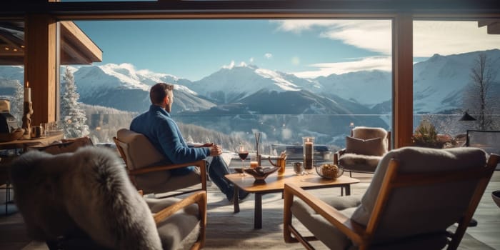 Traveler enjoying weekends inside contemporary barn house in the mountains. Happy tourist looking through panoramic windows in new cottage. comeliness