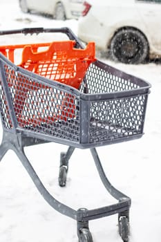 Shopping cart for outdoor shopping in the snow close up