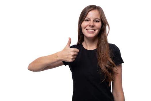 Caucasian brown-haired woman communicates an idea and holds a thumbs up.