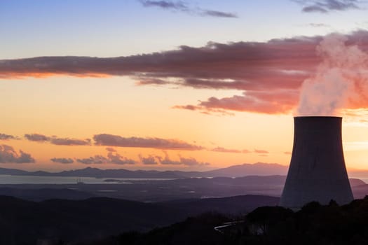 Sunset at the power plant for the exploitation of boraciferous blowers for the production of electricity in Tuscany, Italy 