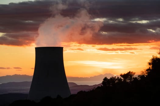 Sunset at the power plant for the exploitation of boraciferous blowers for the production of electricity in Tuscany, Italy 