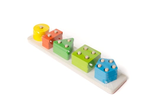 New children's wooden educational toy packed in polyethylene on a white background.